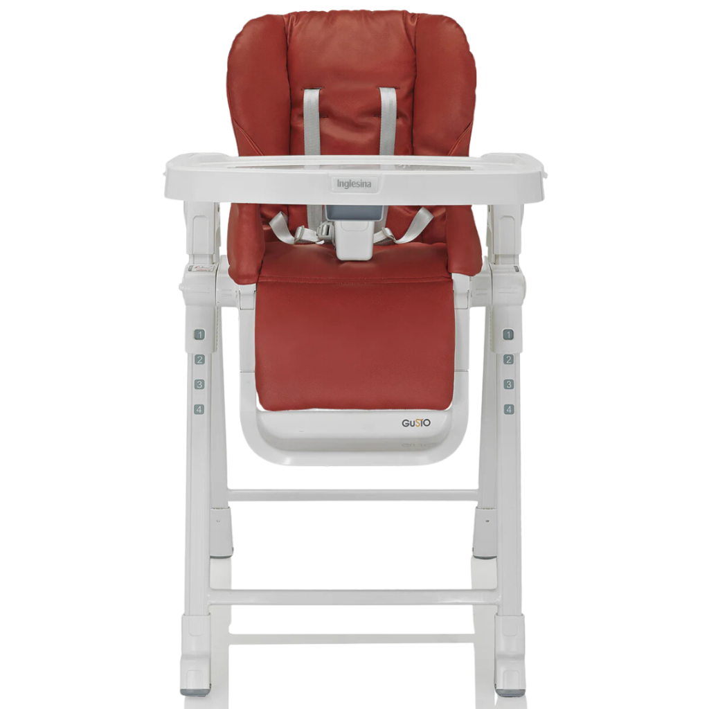 a red highchair with a white frame